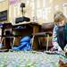 Girl scout and fifth-grade student Lexi Miller finishes a blanket to send to the New Hope Baptist Church in Newark, New Jersey on Tuesday, Jan. 22. Daniel Brenner I AnnArbor.com